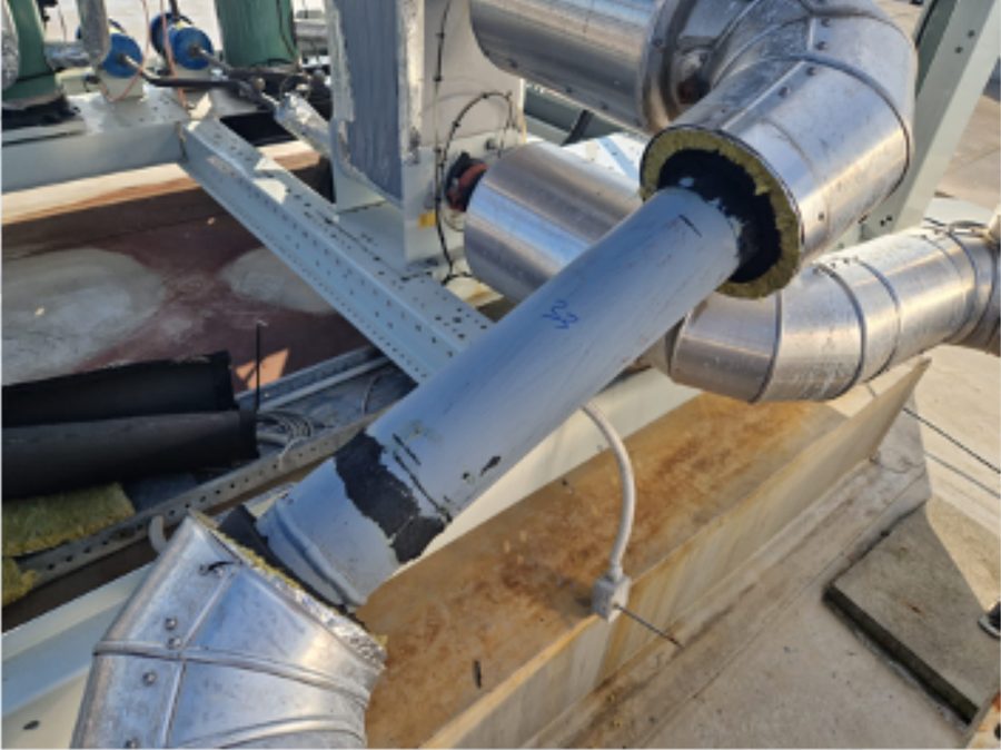 Foam insulation folded back to expose the bare pipe